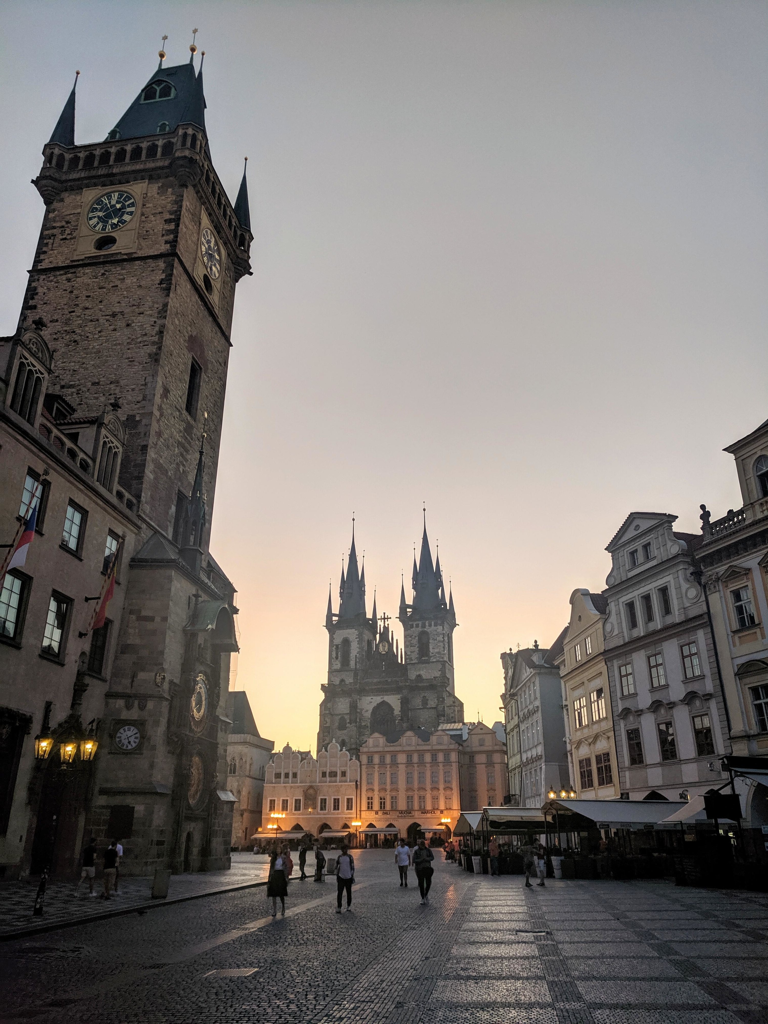 the sun rising behind the Church of Our Lady before Týn in Prague
