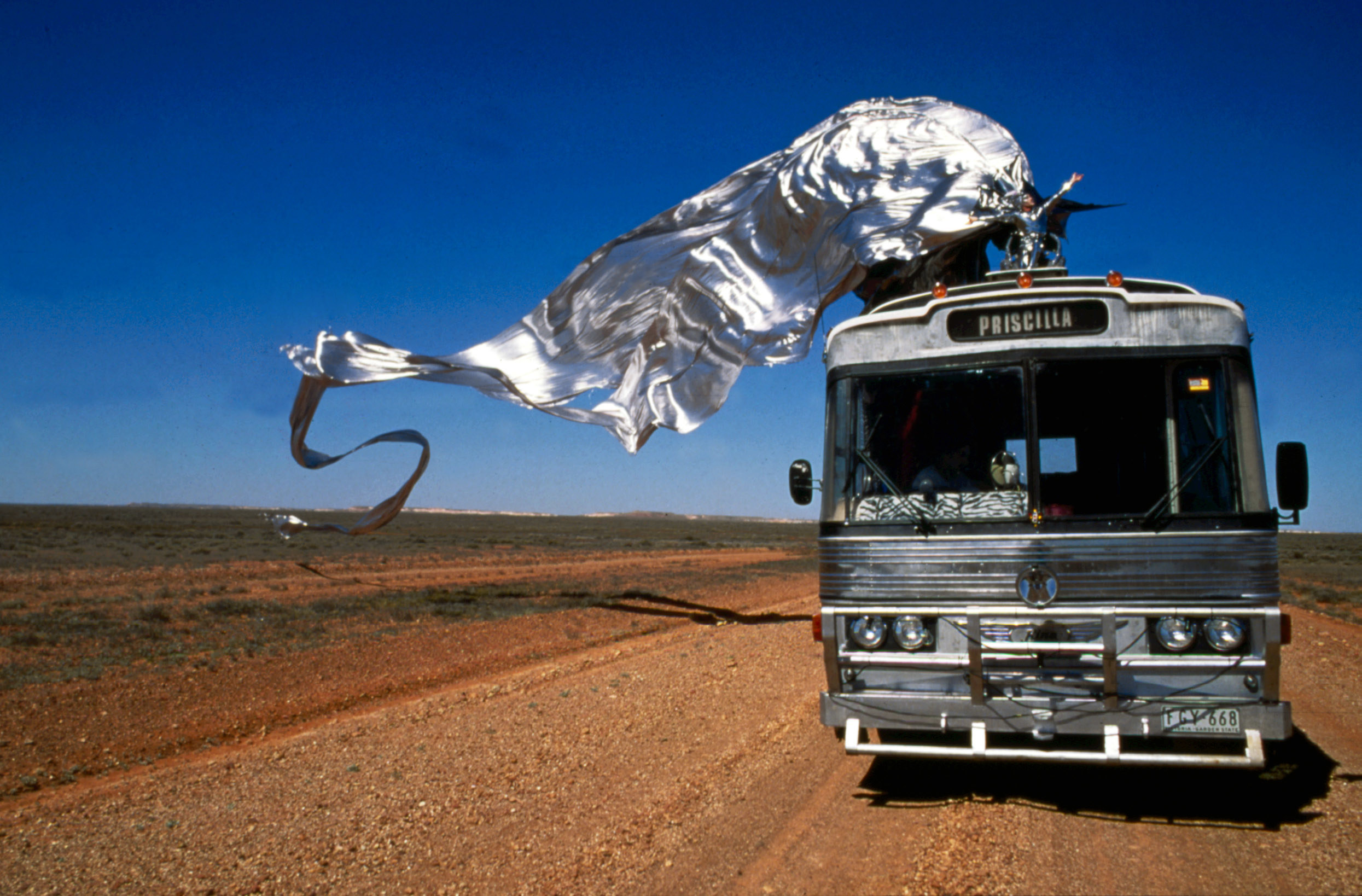 The silver costume with its huge cape on top of the bus, Priscilla