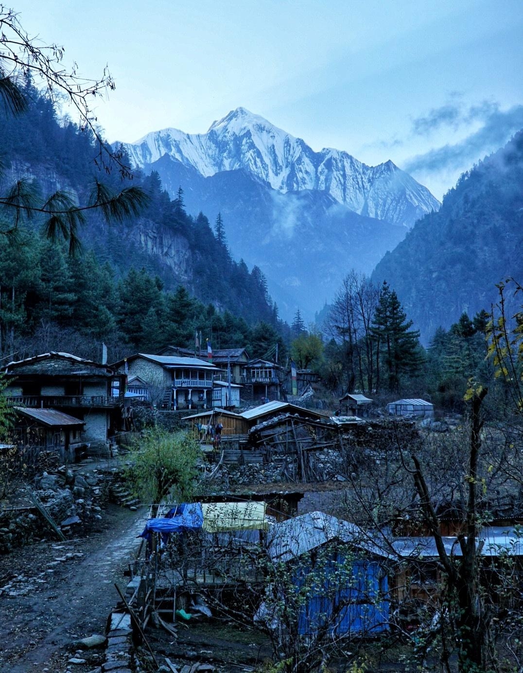 A view of a village in a valley near the base of the Himalaya Mountains in Nepal