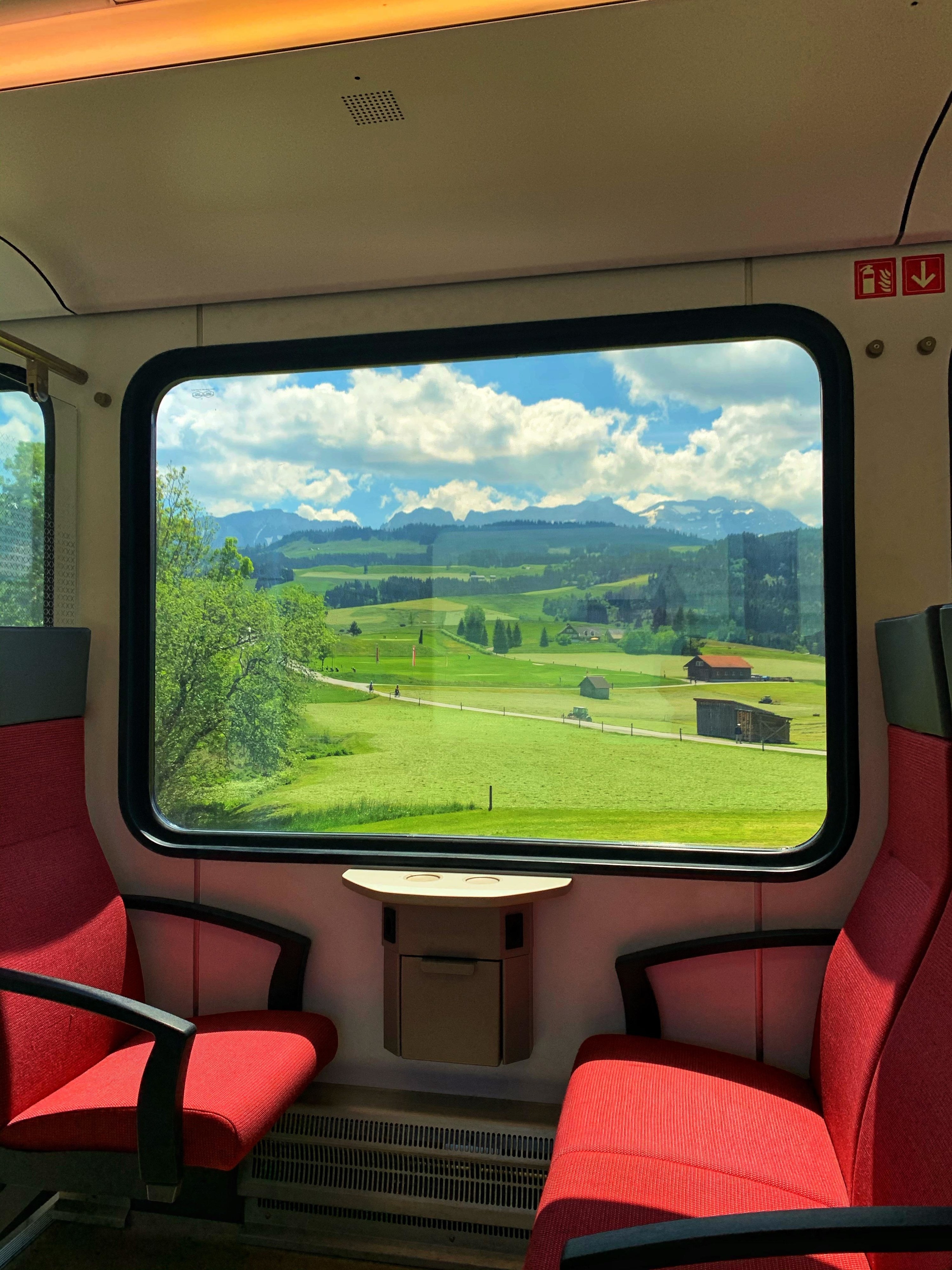 A view of a valley in Appenzell, Switzerland from a train window
