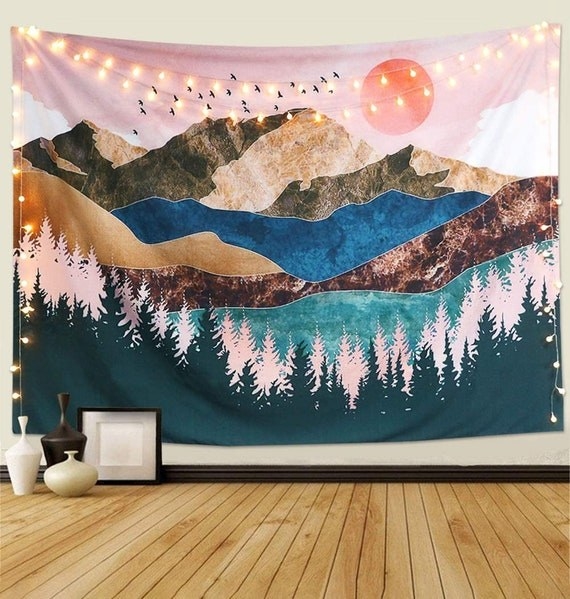 Nature moon mountain tapestry hanging over a bed