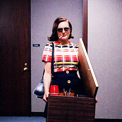 peggy olson strutting out of the office with her box of office supplies
