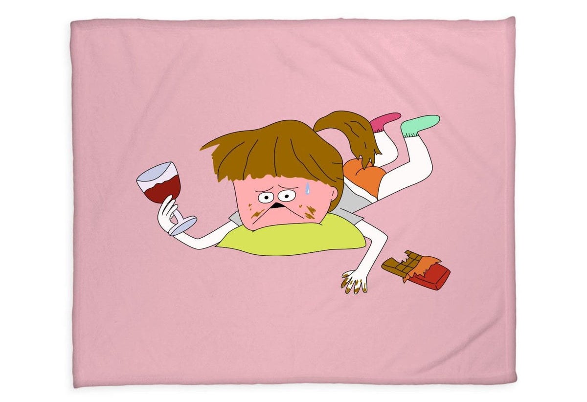 the pink blanket with a cartoon person drinking wine and eating chocolate