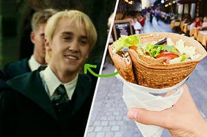 Draco Malfoy wears his Slytherin robes and a hand holds a crepe filled with lettuce and meat