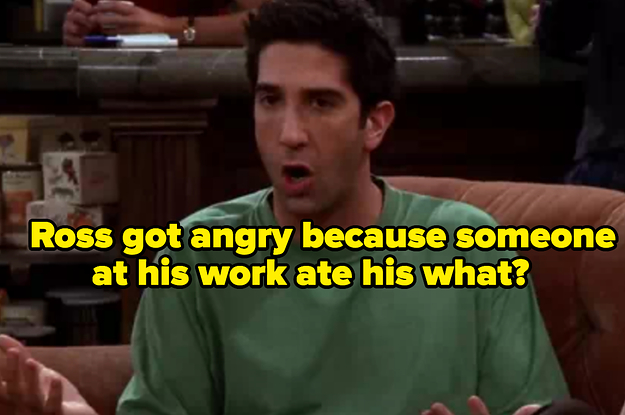 A close up of Ross Geller as he angrily sits on a couch