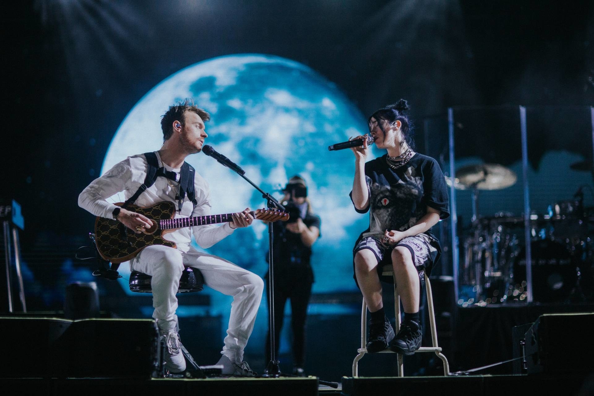 Billie Eilish and Finneas O’Connell on stage in “Billie Eilish: The World’s A Little Blurry.&quot;