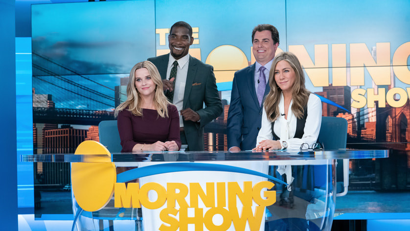 The cast of the Morning Show sit at their desk