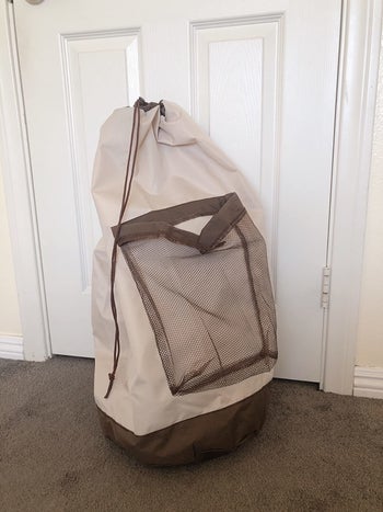 reviewer image of the khaki laundry backpack