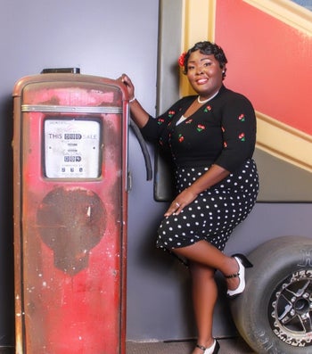 reviewer wearing the black sweater