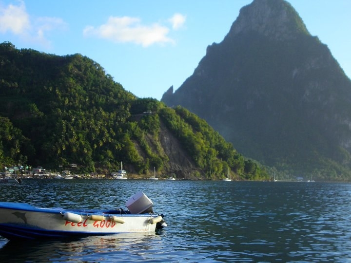 Boat on the water with mountain in background