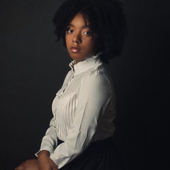 side view of reviewer wearing the white button-down