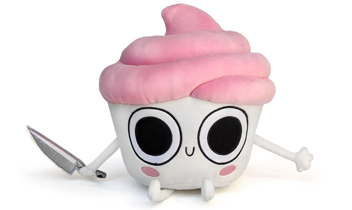 Cupcake plushy with white bottom and face, pink frosting top, holding a knife