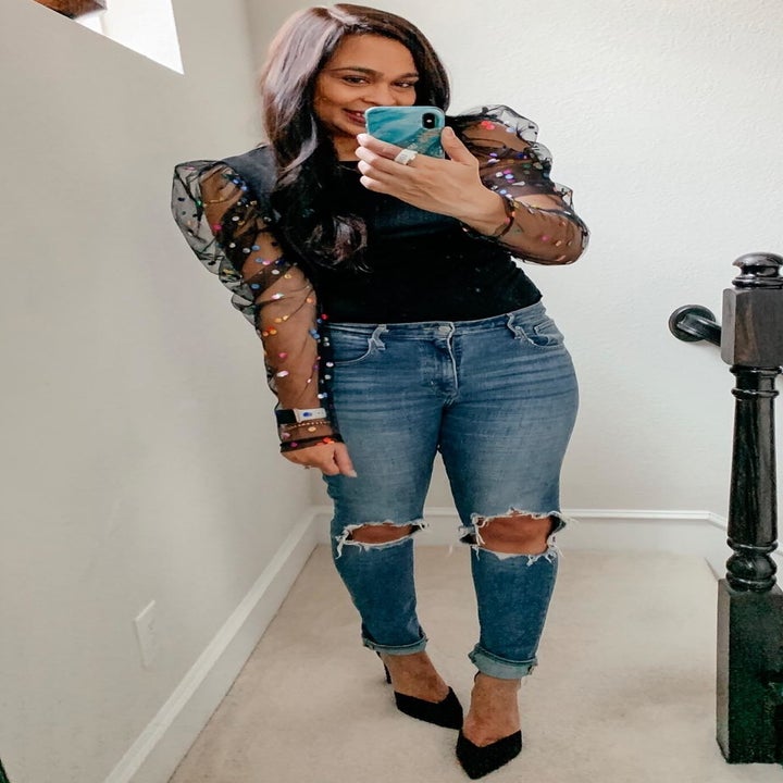 reviewer wearing the mesh puffed sleeve top
