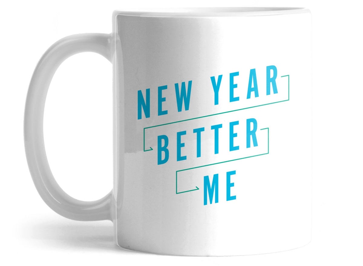 White mug that says &quot;New Year Better Me&quot; in blue writing