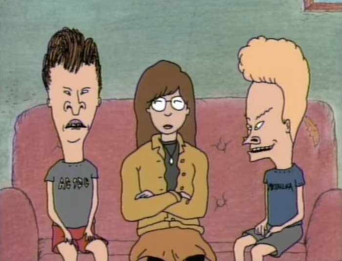 Beavis and Butt-head sitting on their couch with Daria