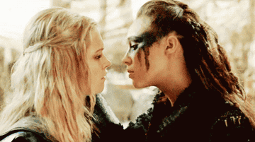 Eliza Taylor as Clarke and Alycia Debnam-Carey as Lexa kissing in &quot;The 100&quot;