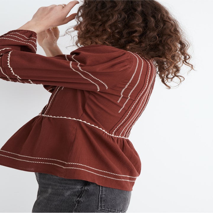side view of model wearing the brown top