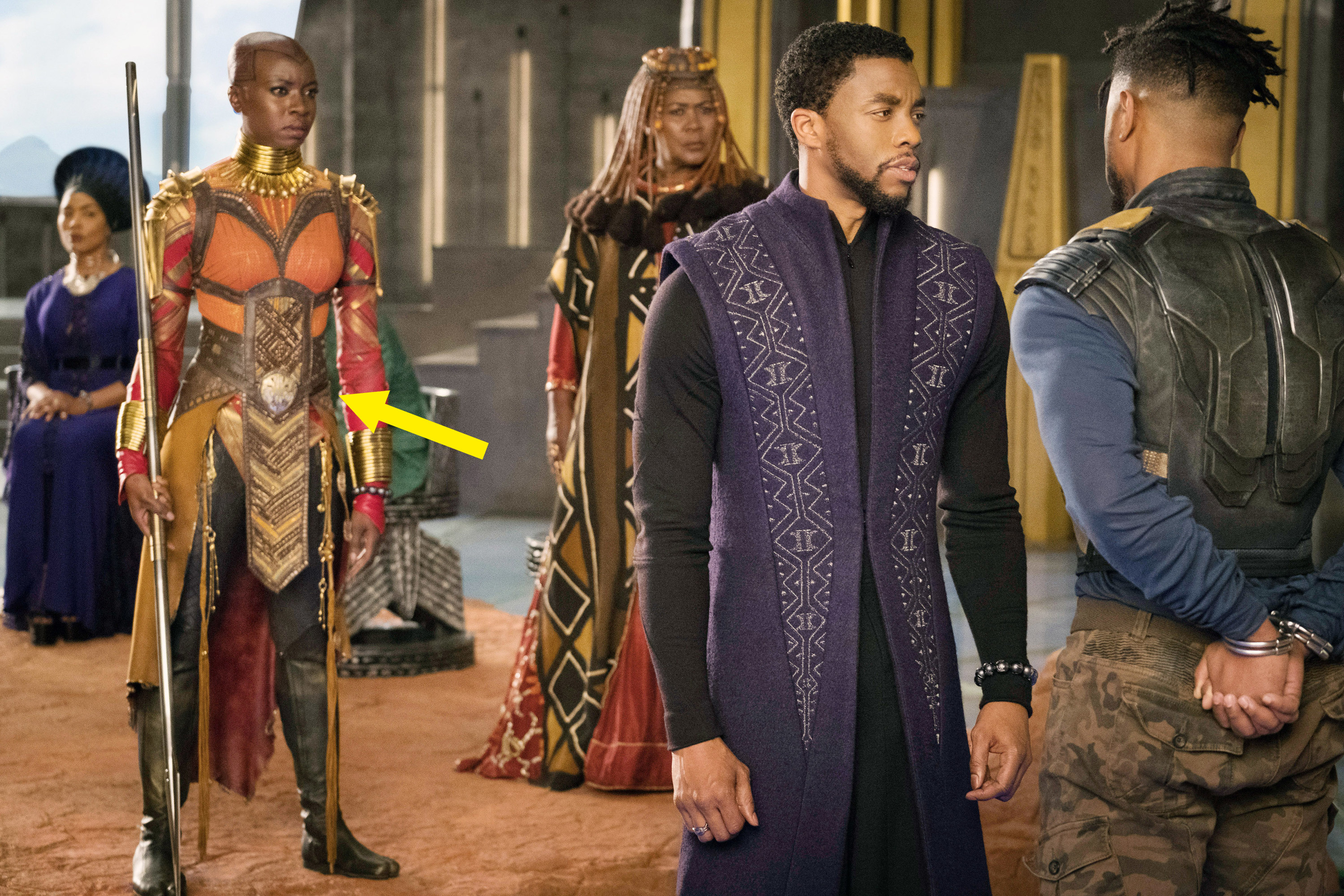 Okoye stands in the background while T&#x27;Challa speaks to his cousin