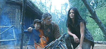 Shelby Flannery as Hope, Ivana Miličević as Diyoza, and Marie Avgeropoulos as Octavia hugging in &quot;The 100&quot;