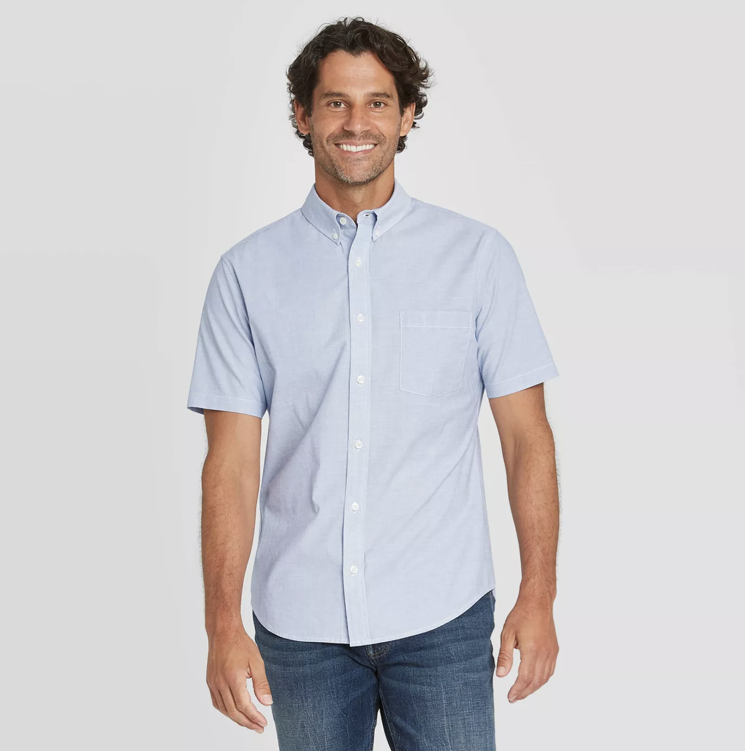 model wearing the button up shirt in blue