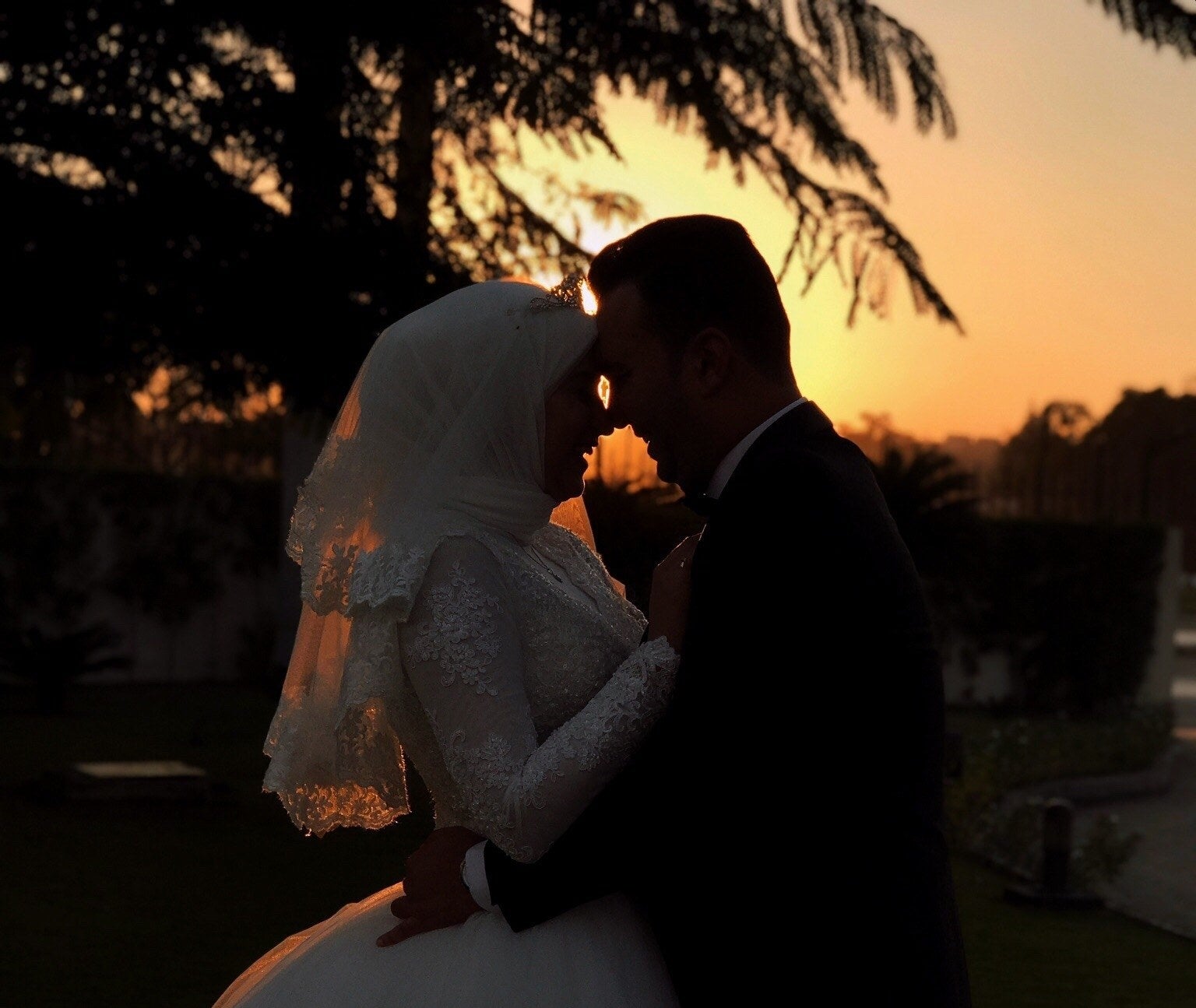 A bride and groom in the sunset