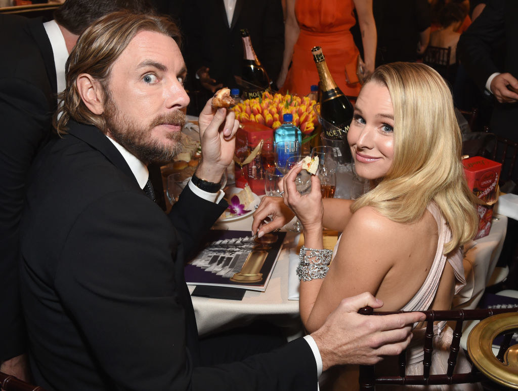 at their table inside the Golden Globes, Dax and Kristen sample finger foods