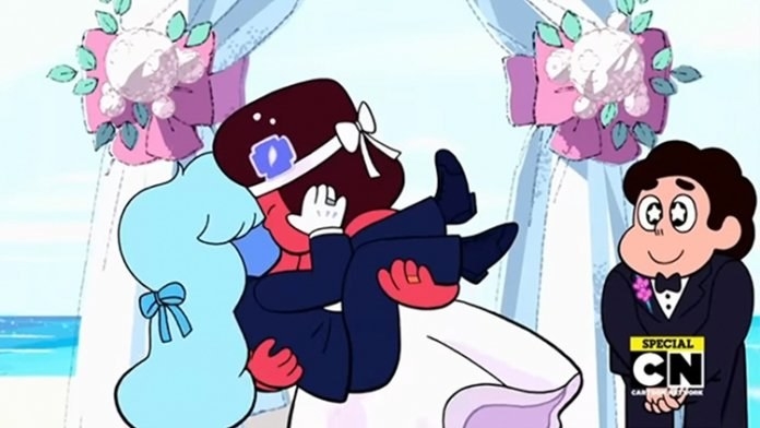 Ruby and Sapphire kiss at their wedding as Steven looks on with a smile and stars in his eyes