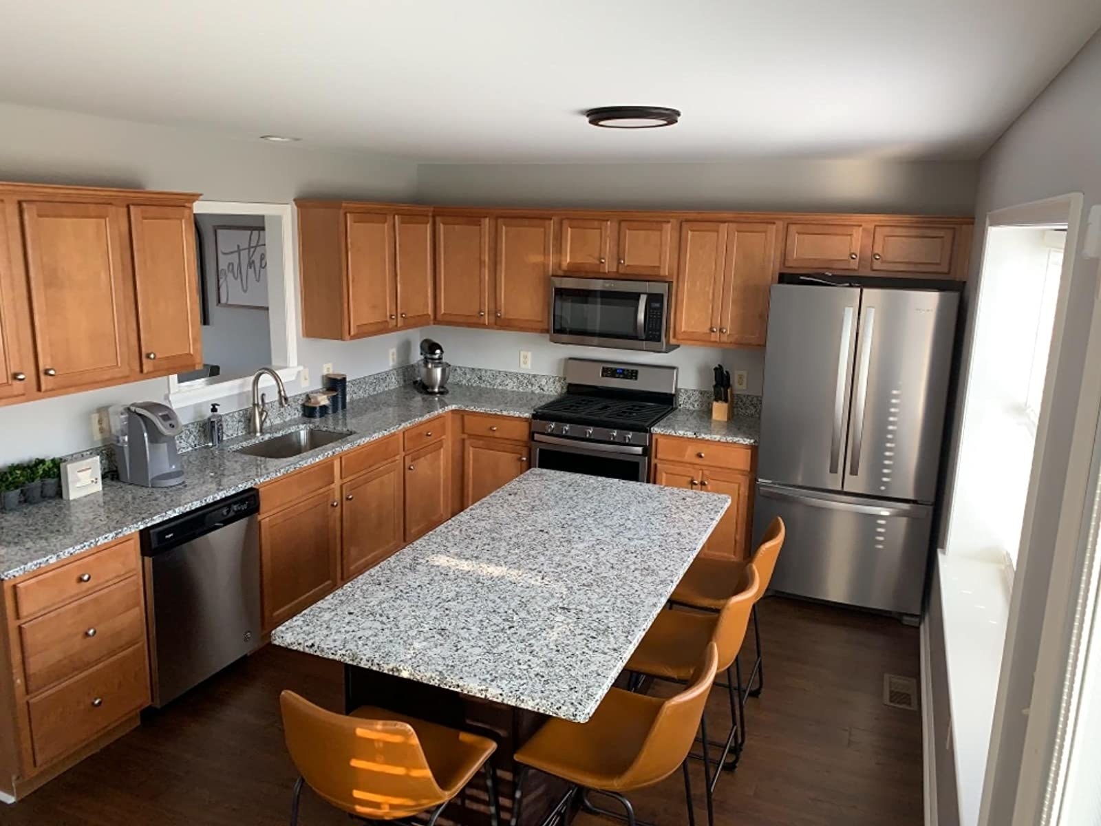 reviewer before image of natural wood kitchen cabients