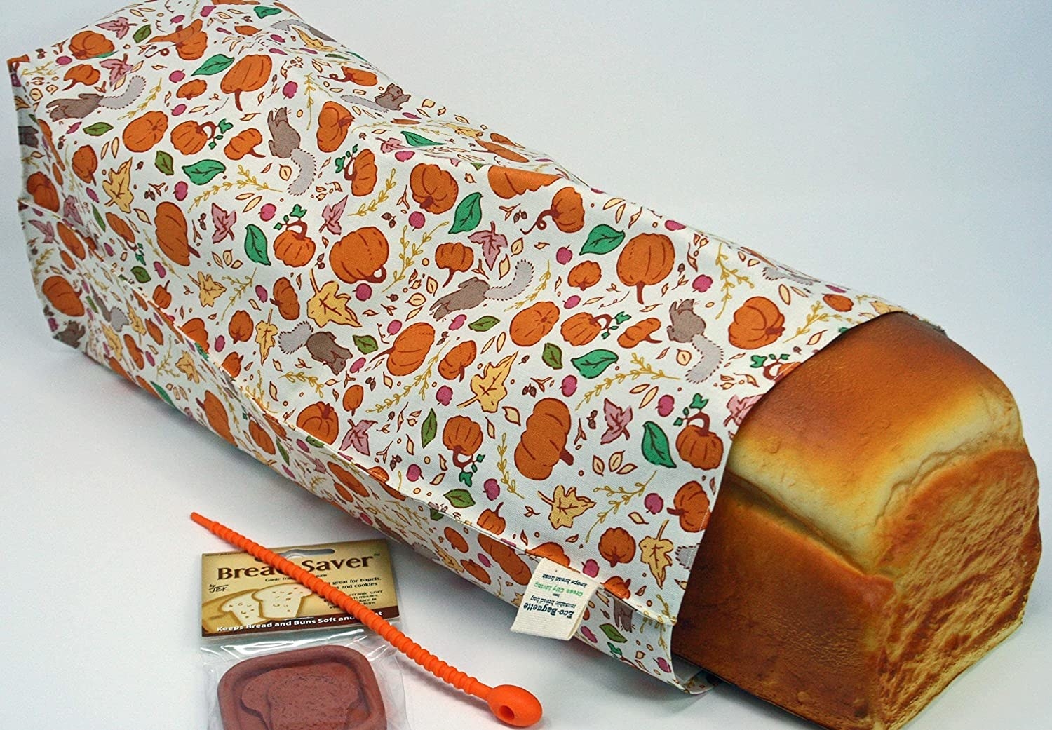 a loaf of bread in a fall-themed bread bag