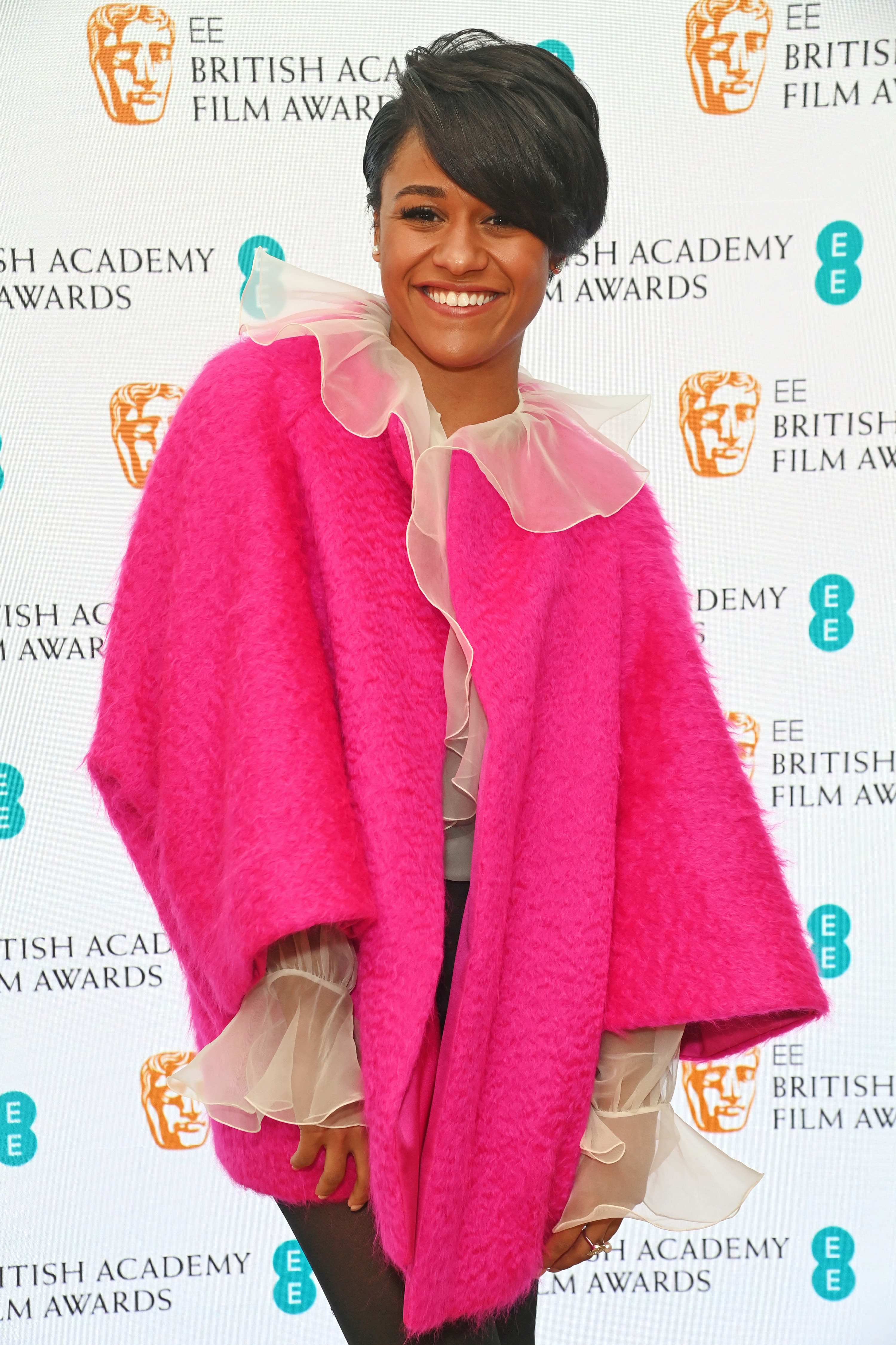 Ariana smiling on the BAFTAs red carpet