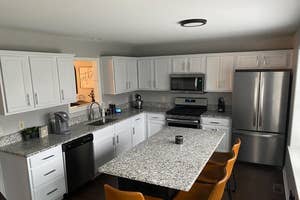 after reviewer image of kitchen cabinets painted white