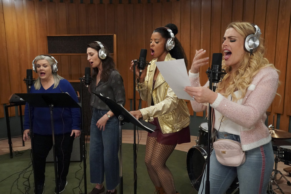Busy Philipps, Renée Elise Goldsberry, Sara Bareilles, and Paula Pell singing in a studio