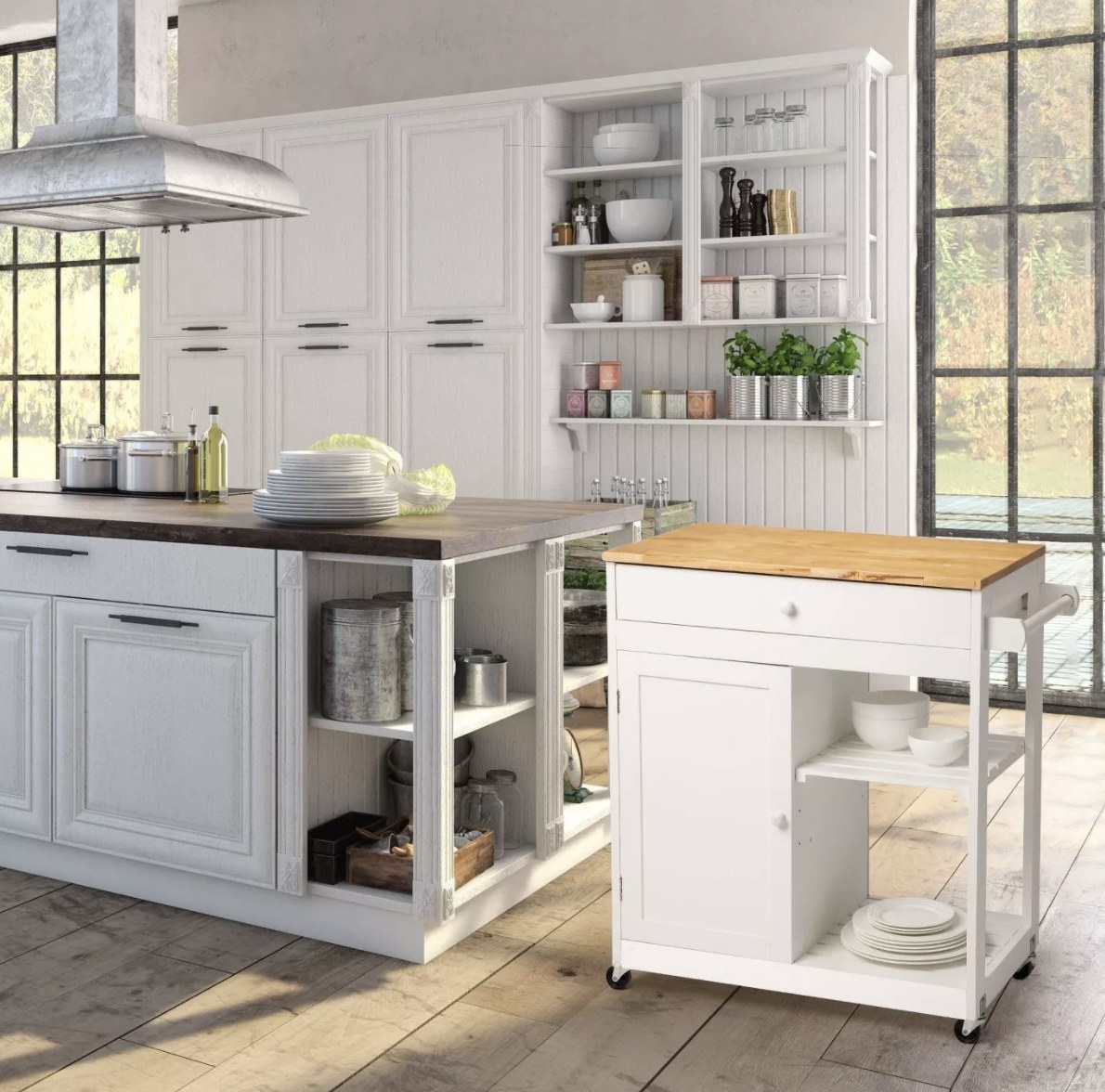 The white kitchen island has a light brown top, two drawers and two shelves