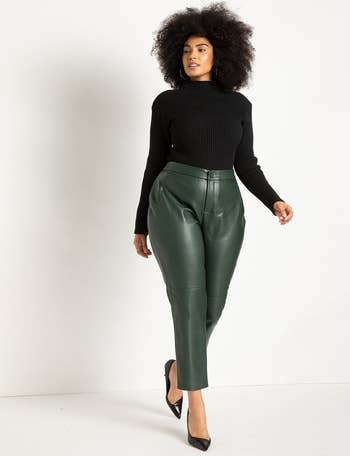 model wearing green leather pants and black pumps