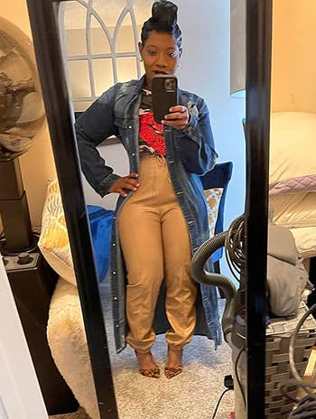 reviewer mirror selfie wearing tapered cropped beige leather pants