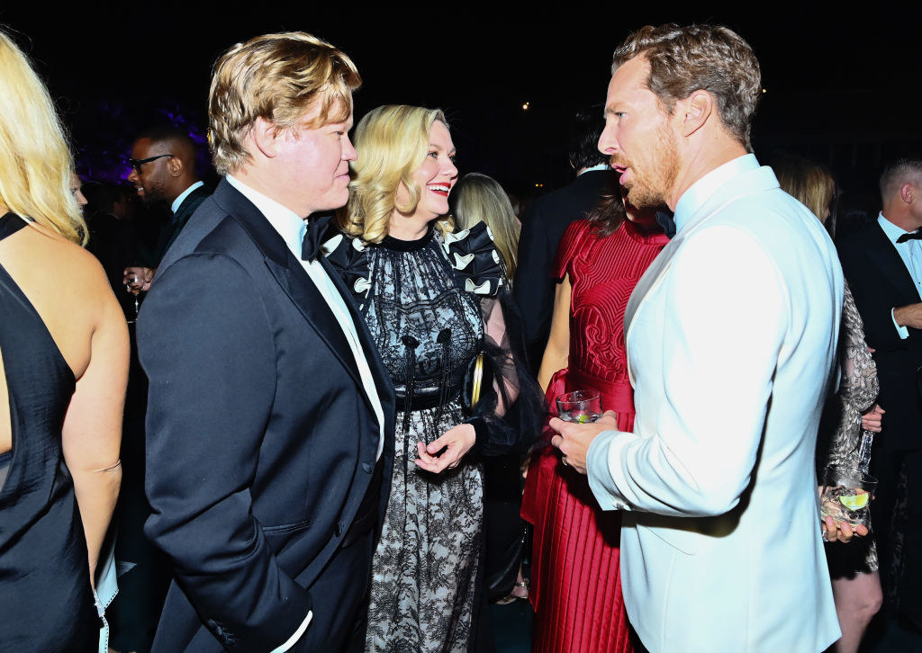 Jesse, Kirsten, and Benedict talking at formal event