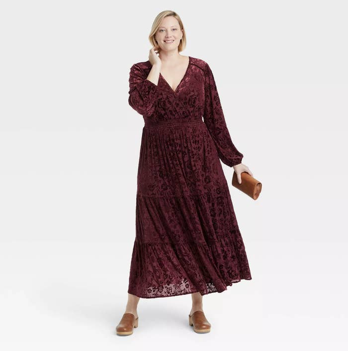 model wearing the dress in burgundy