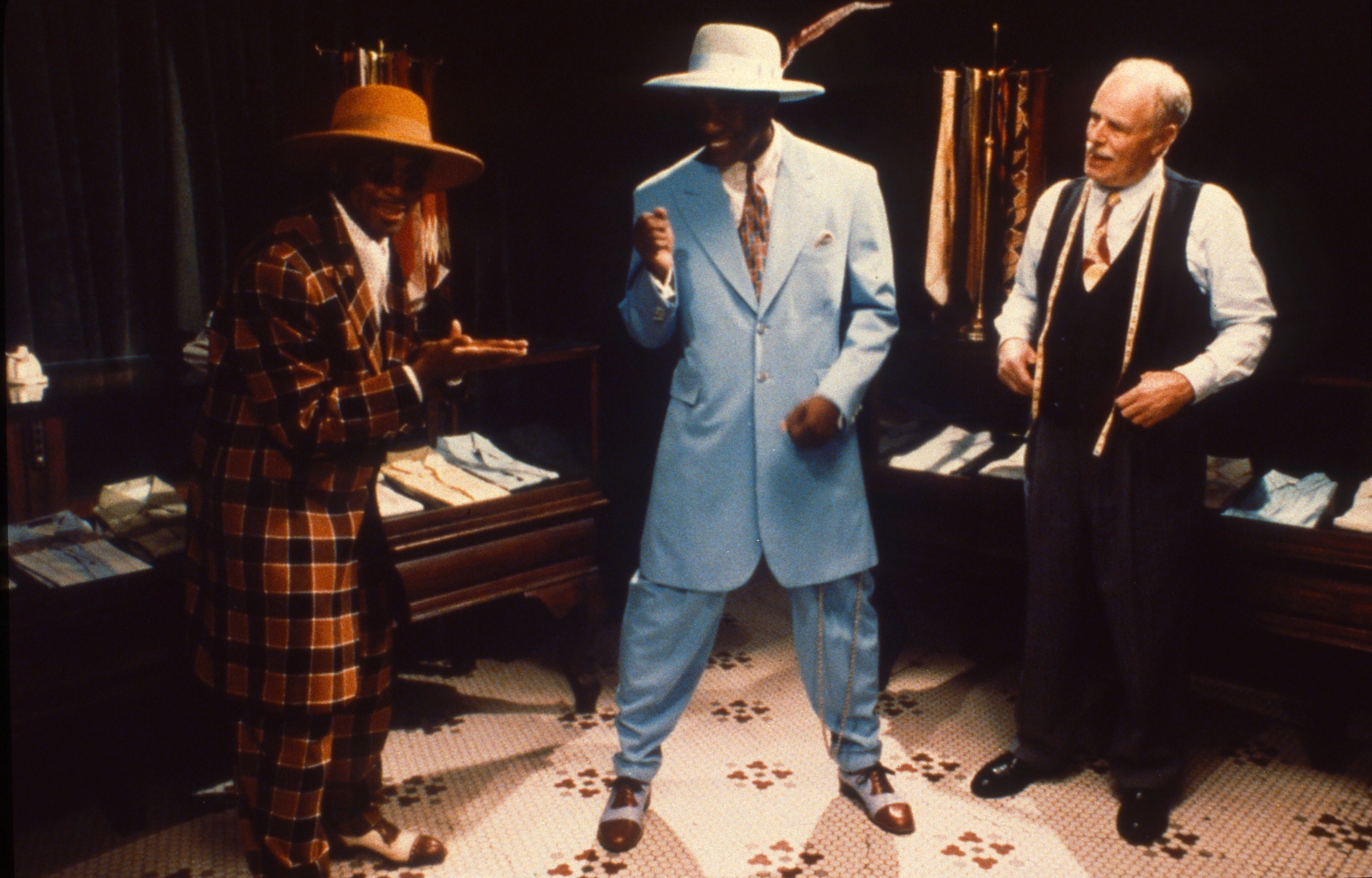 Malcolm X getting fitted for the blue zoot suit