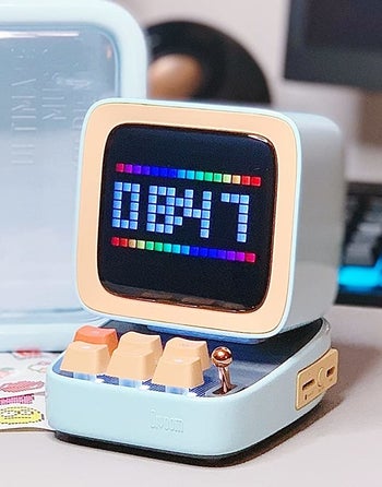 the retro-style Bluetooth speaker on a reviewer's work desk