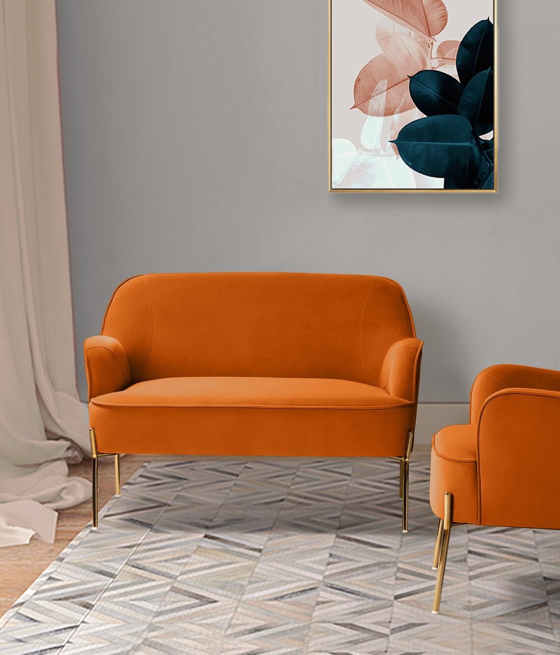 An orange velvet love seat in a living room.