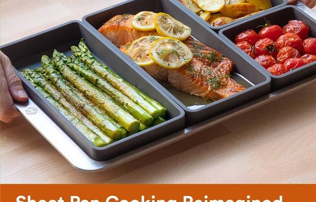 the four pan dividers with vegetables and salmon and carbs being cooked separately