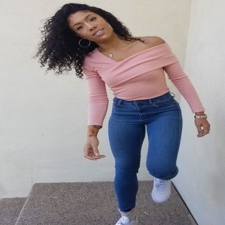 reviewer wearing the pink top