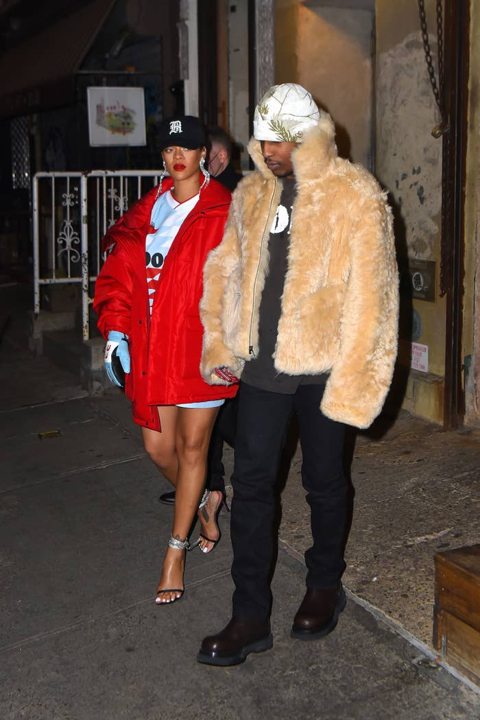 Rihanna steps out with ASAP Rocky in an oversized red parka and oversized hoodie