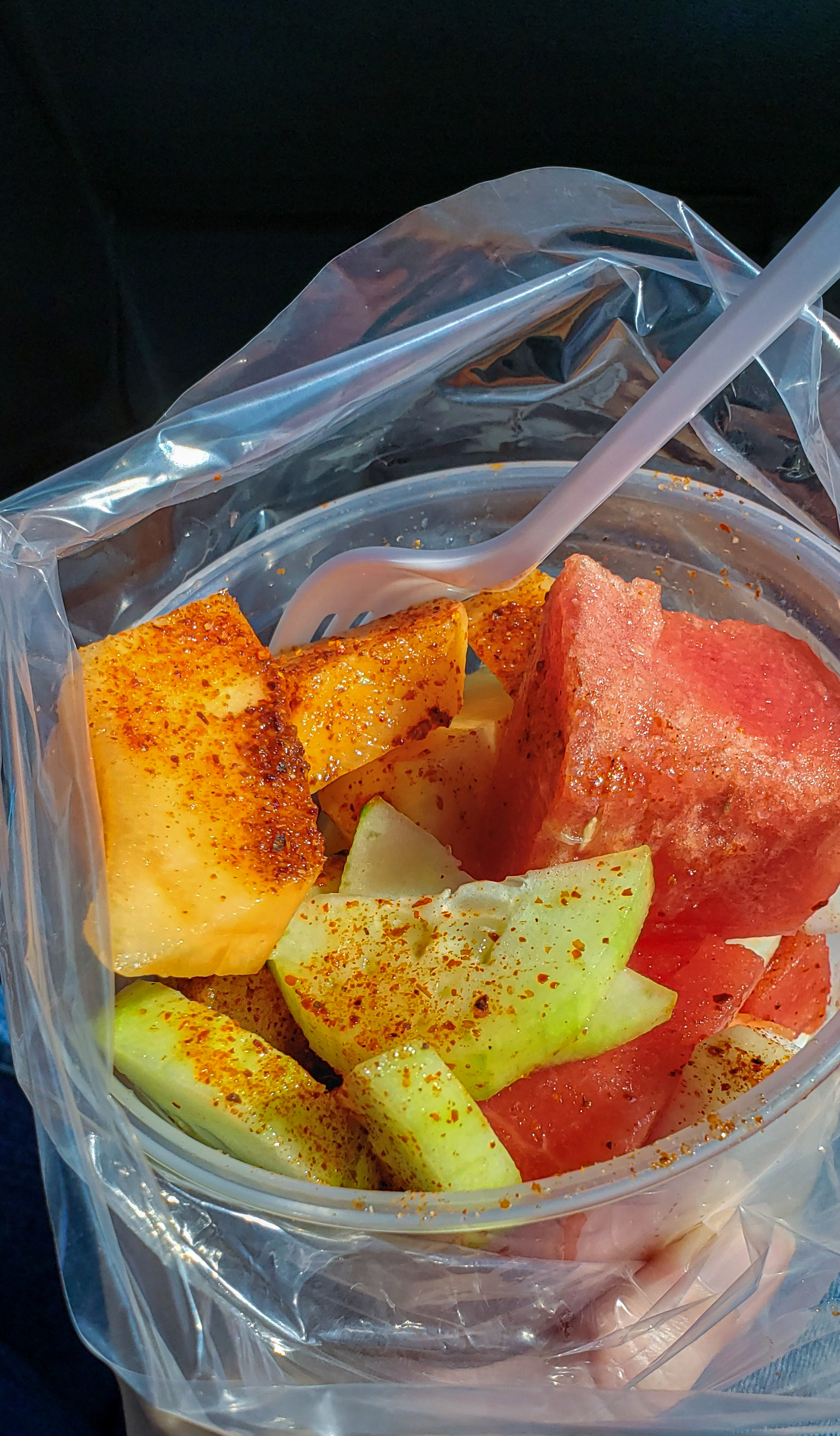 Sliced fruit with Tajin spice