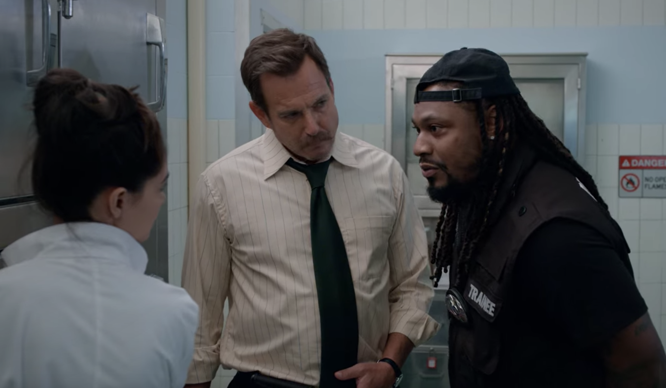 Detective Terry Seattle (Will Arnett) looks inquisitively at Marshawn Lynch