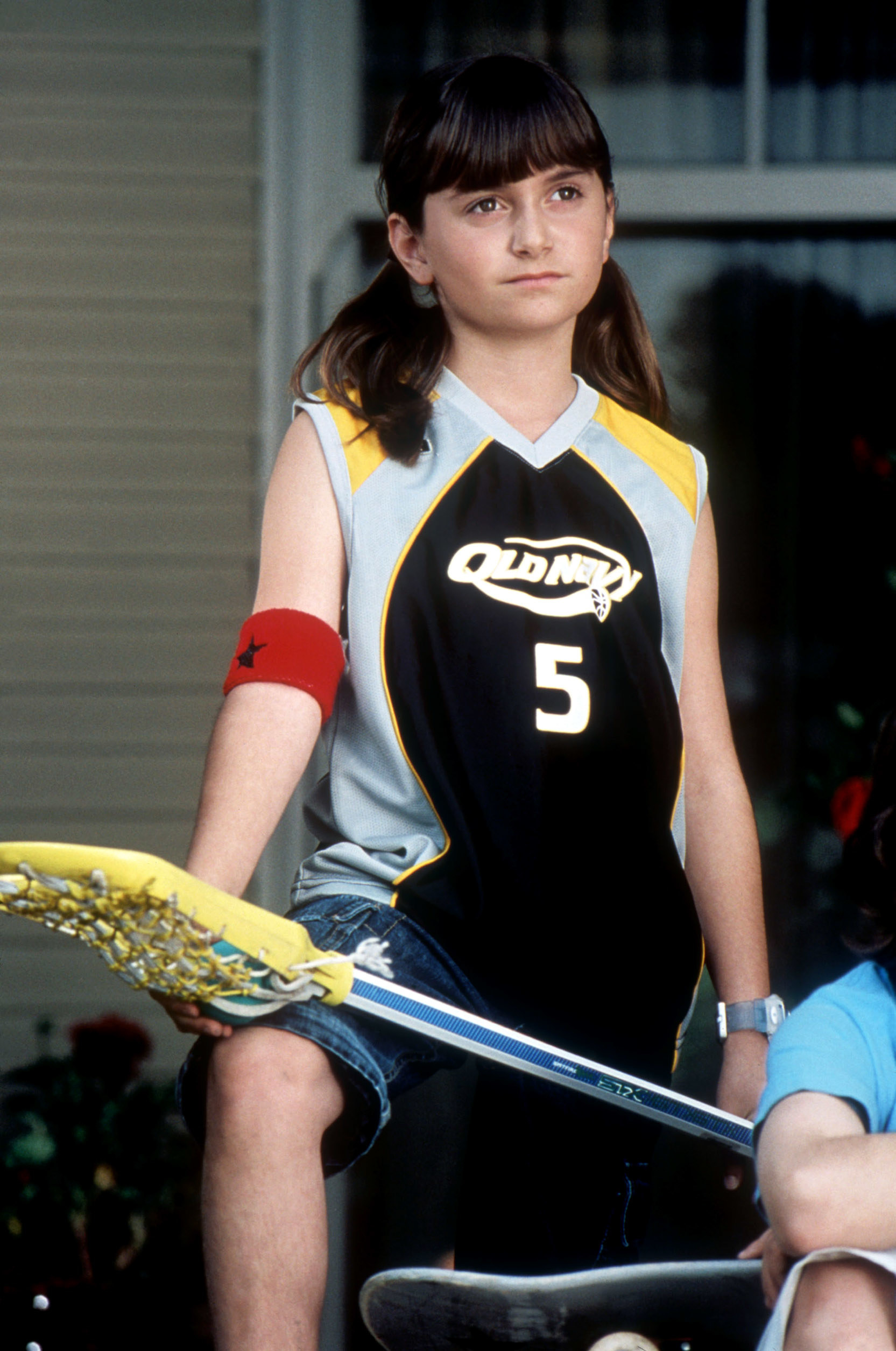 Sarah holding a lacrosse stick