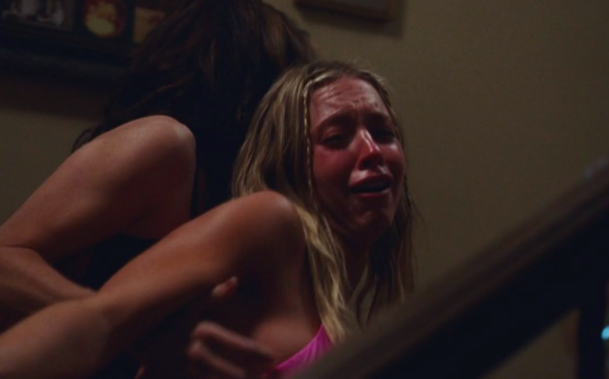 Cassie being dragged away as she breaks down in tears