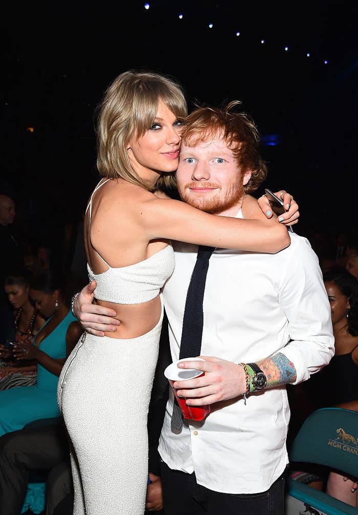 The two artists hugging each other at an event