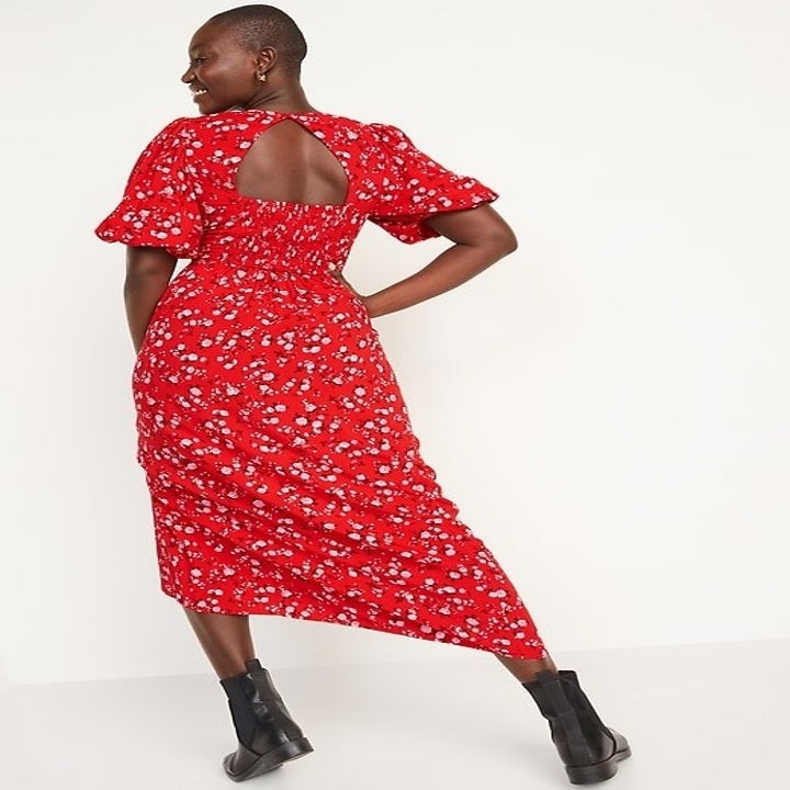 model wearing the red floral dress
