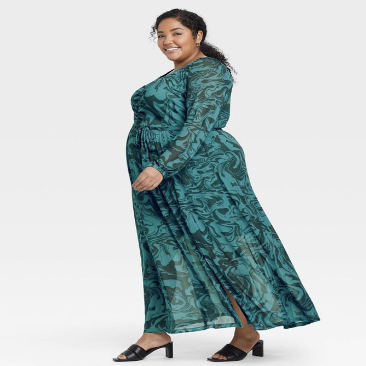 side view of model wearing the green dress